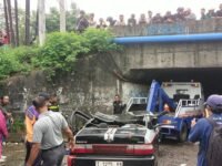 Lokasi kejadian truk kontainer terguling dan menimpah minimbus berpenumpang satu keluarga di Jalan Raya Tanggul Rawagabus, Desa Kondangjaya Kecamatan Karawang Timur, Jawa Barat. (Mediaseruni)